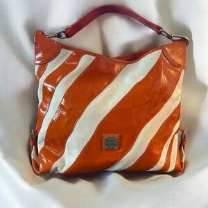 Dooney and Bourke Tote Bag - Vibrant orange and cream zebra-striped design.